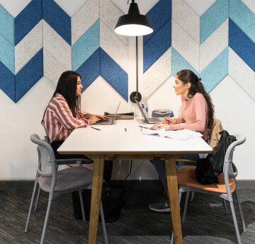 Image of students having a conversation