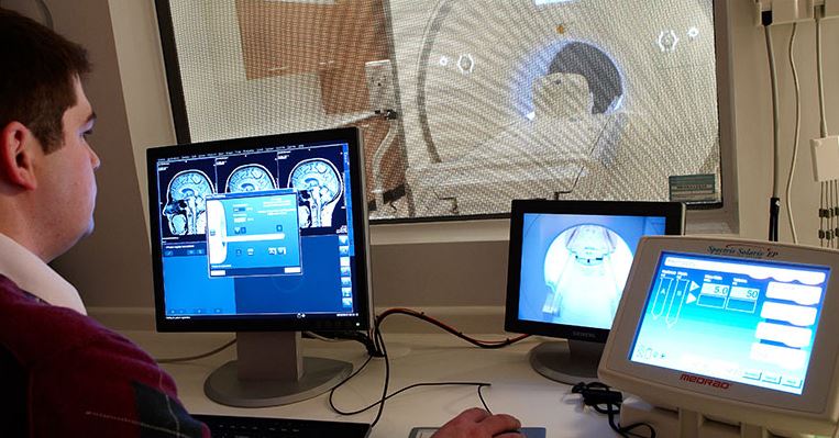 Student working on laptop monitor screens 
