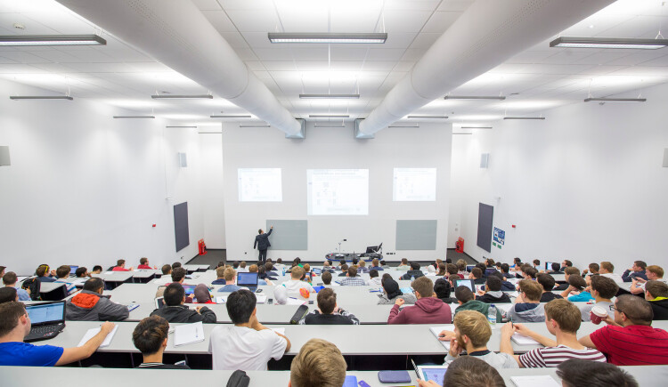 Students listening to a lecture. 