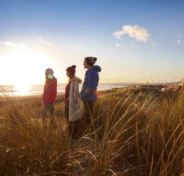 Three students standing outside