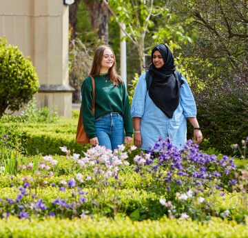Students walking by The Abbey talking