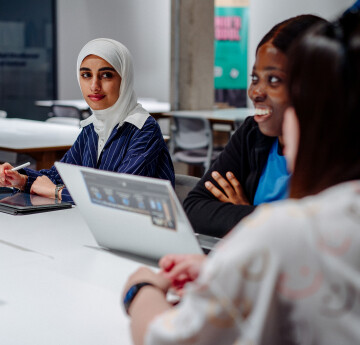 Students talking in Library