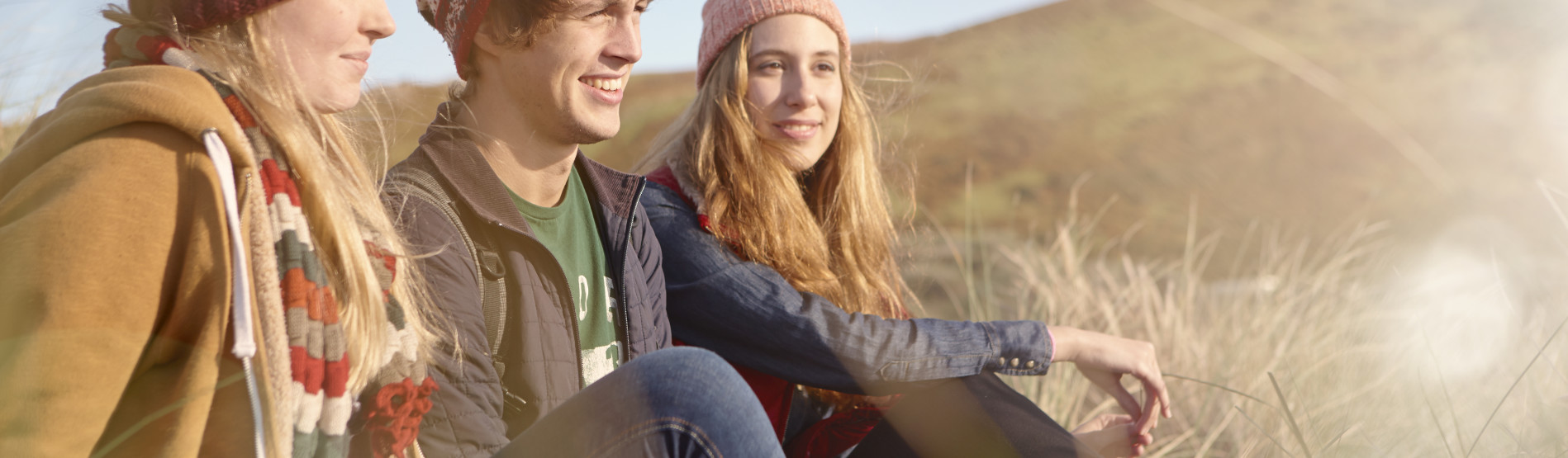 Students sitting on sand dunes