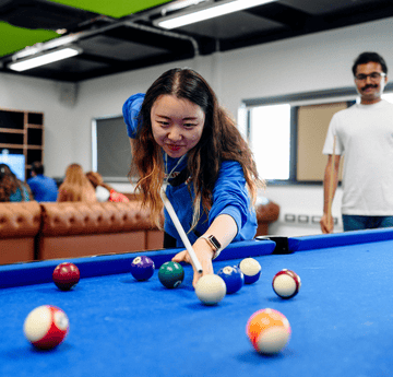 Student playing pool