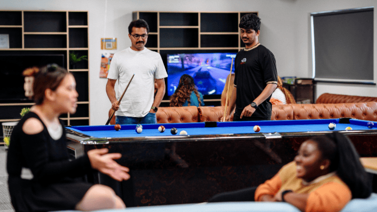 Students playing pool in Y Twyni