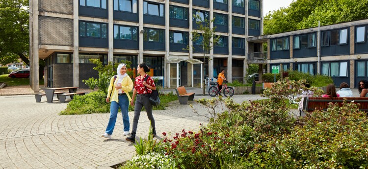 Photograph of students walking past Cefn Bryn on Singleton Park Campus